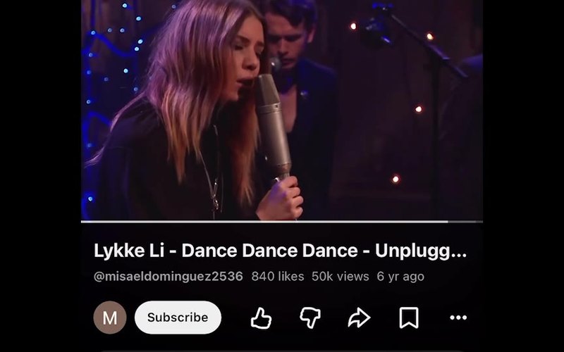 Still from the clip: a YouTube player showing Lykke Li singing into a studio microphone.